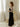 Textured velvet maxi dress with cowl neckline, adjustable spaghetti straps, and slip-style silhouette.