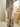 Low-rise velvet maxi skirt with watercolor print, elastic waistband, side slit, and stretchy pull-on fit.