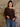 Model wearing an oversized waffle knit sweater in a soft, cozy fabric with long sleeves and a relaxed, stretchy fit.
