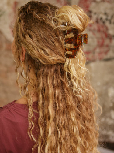 Acrylic hair claw clip in a stylish design.