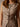 Long sleeveless vest with high neck, button-up front, dainty floral print, and fitted back with gold pin.