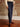 Mid-rise straight leg jeans with utility front pockets, back pockets, belt loops, and button-zip closure.