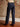 Mid-rise straight leg jeans with utility front pockets, back pockets, belt loops, and button-zip closure.