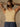 Sleeveless high neck top with shimmer threading, seamless construction, normal length, and ultra-stretchy fit.