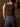 Sleeveless high neck top with shimmer threading, seamless construction, normal length, and ultra-stretchy fit.