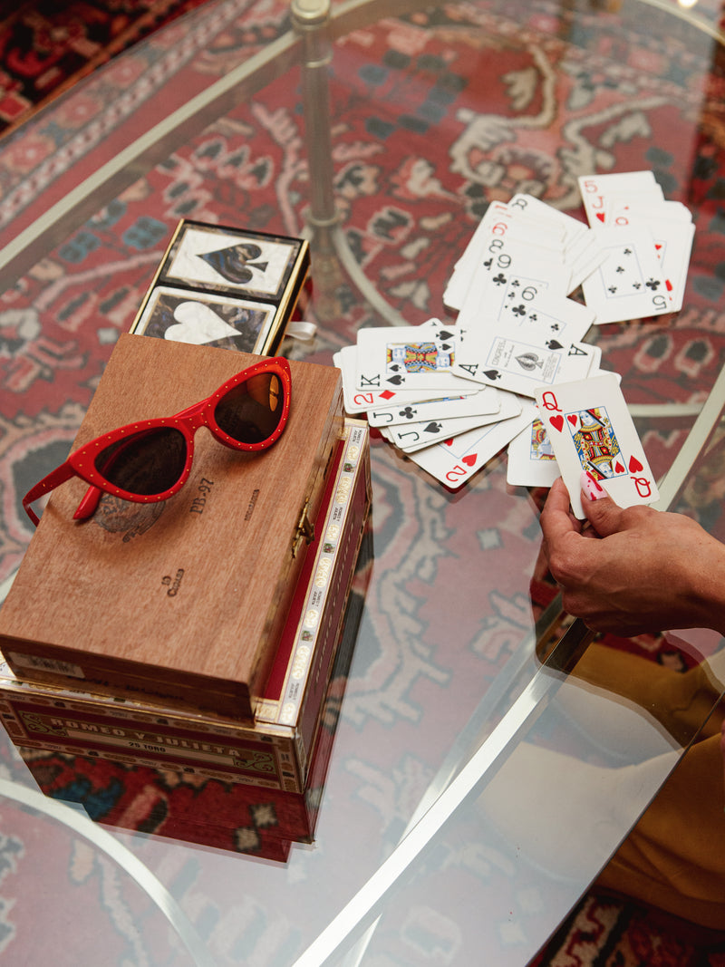 Sunnies & a deck of cards.