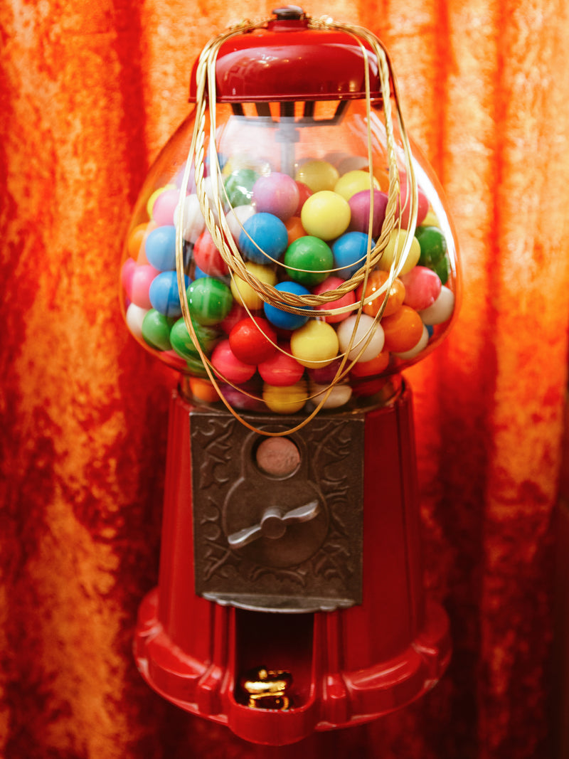 Bubblegum machine with necklace.