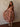 Fleur Long Sleeve Dress with high neck, long sheer sleeves, drop waist, floral print, asymmetrical hem, pull-on design, and midi length.