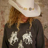 Faux suede Western-style hat with concho belt strap and adjustable inner cinch.