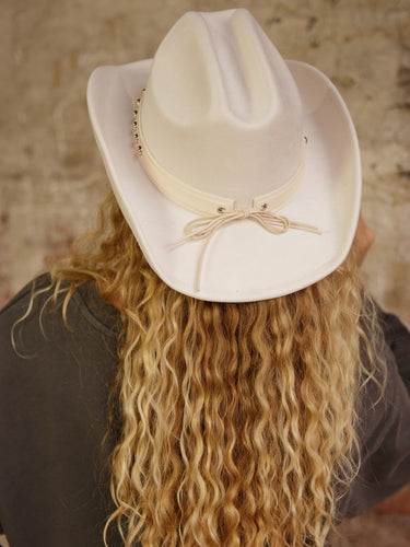 Faux suede Western-style hat with concho belt strap and adjustable inner cinch.