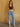 Show Me Love Flare Jeans, mid rise denim with button and zipper closure, belt loops, 4-pocket design, pleated detailing, and relaxed flare silhouette.