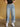 Stay Focused Barrel Jeans, mid rise denim with button and zipper closure, belt loops, 5-pocket design, exposed stitching, cuffed hem, and barrel silhouette.