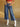 Future Tripping Wide Leg Jeans, high rise denim with button and zipper closure, belt loops, large patch pockets, cropped length, and wide leg style.