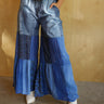 Gale Patchwork Pants, high rise wide-leg pants with thick elastic waistband, adjustable drawstring, front pockets, floral and denim patchwork, and partially sheer fabric.