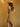 Meira Golden Bodycon Dress, strapless maxi dress with asymmetrical hem, side ruching, subtle sparkles, and stretchy bodycon fit.