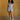 Shannon Denim Romper, collared cap-sleeve romper with zip-up front, waist belt, front and back pockets, lightweight denim, and stretch fabric.