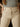 High rise wide leg jeans with button and zipper closure, front and back patch pockets, cropped fit, and raw hem.
