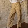 High rise floral barrel-leg jeans with button and zipper closure, belt loops, and 5-pocket design.