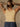 Sleeveless high neck top with shimmer threading, seamless construction, normal length, and ultra-stretchy fit.