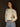 Long sleeve knit sweater with crew neck, contrast trim, rolled hem, 3D flower print, relaxed fit, and slight stretch.
