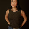 Sleeveless high neck top with shimmer threading, seamless construction, normal length, and ultra-stretchy fit.