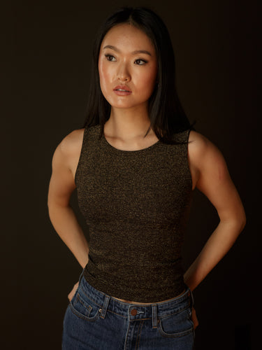 Sleeveless high neck top with shimmer threading, seamless construction, normal length, and ultra-stretchy fit.