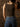 Sleeveless high neck top with shimmer threading, seamless construction, normal length, and ultra-stretchy fit.