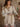 Long sleeve textured button-up shirt with collar, chest pocket, button cuffs, relaxed fit, long length, lined, and slight stretch.