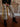 High rise slim wide-leg pants with zipper and button closure, belt loops, back pockets, raw hem, cropped length, and zebra print.