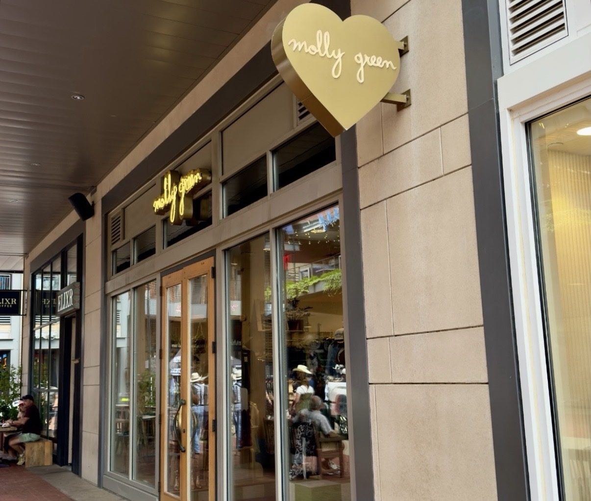 Molly Green on Broadway storefront at Fifth & Broadway with a gold heart sign